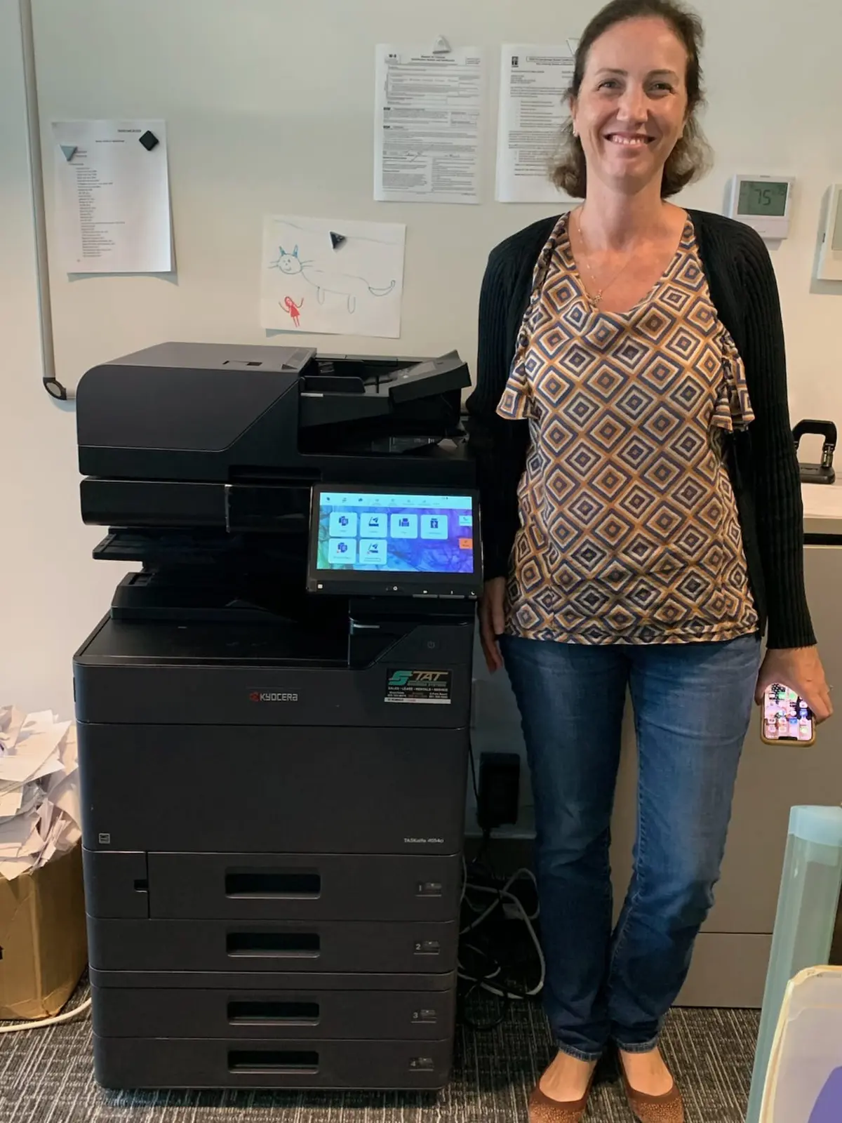 Local copier technician assisting a South Florida office