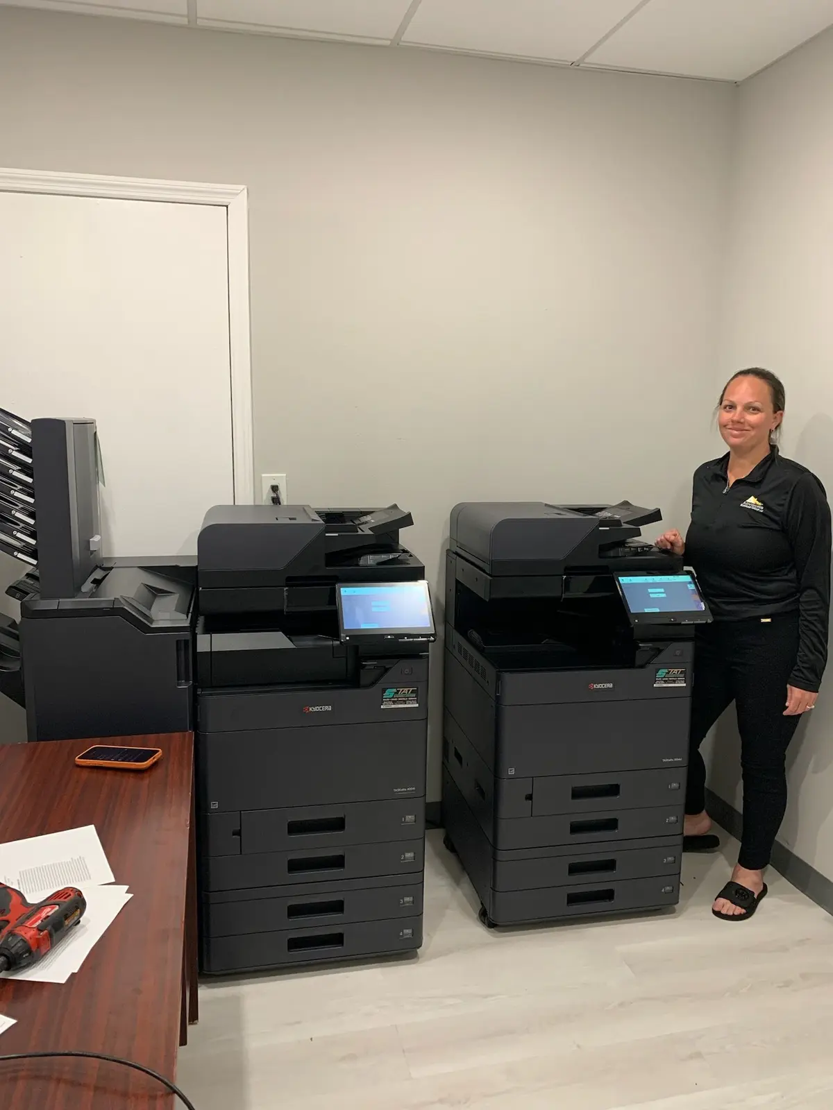 Business owner evaluating whether to repair or replace an office copier