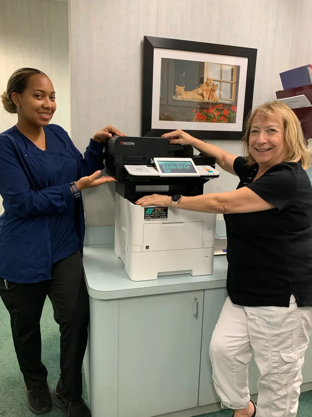 Office employees using a copier for organized document sets